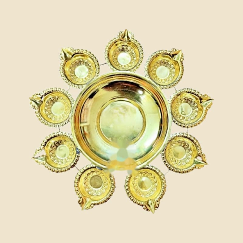Brass Flower Deep Urli on a warm ivory background