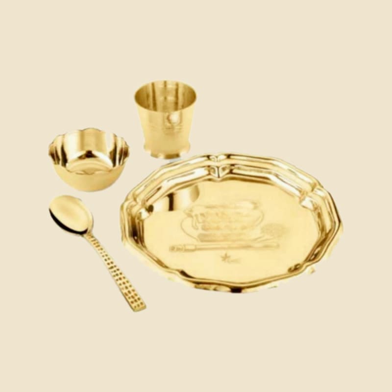 Brass Baby Dinner Set (Plate, Bowl, Glass, Spoon) on a warm ivory background
