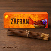 Close-up of Zafran incense stick — rich masala coating with saffron-amber blend