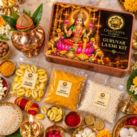 Open kit showing copper kalash, yellow cowries and lotus seeds