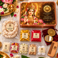 Close-up of Gowri items — sacred thread, jasmine dhoop, kumkum