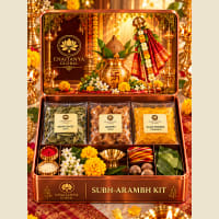Open box showing neem, jaggery, brass lamp and Panchang calendar