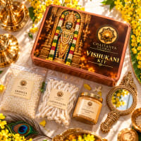 Close-up of Vishu items — mirror, sandalwood oil, jasmine dhoop