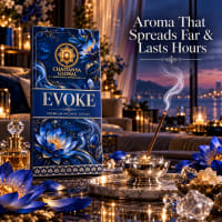 Evoke incense stick burning in a brass holder beside the slim box