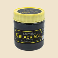 Laxmidevi Black Abil 50 g jar on a warm ivory background