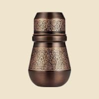 Antique and Etched Copper Water Pot on a warm ivory background