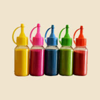 Rangoli Colour Squeeze Bottles, Assorted Colours on a warm ivory background