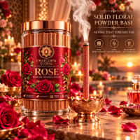 Rose bambooless incense burning in a brass holder at sunset beside the jar