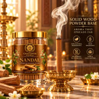 Sandal bambooless incense burning in a brass holder in a golden temple setting