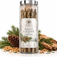 White Cedar smudge incense glass jar with pine cone and cedar bark on a white background
