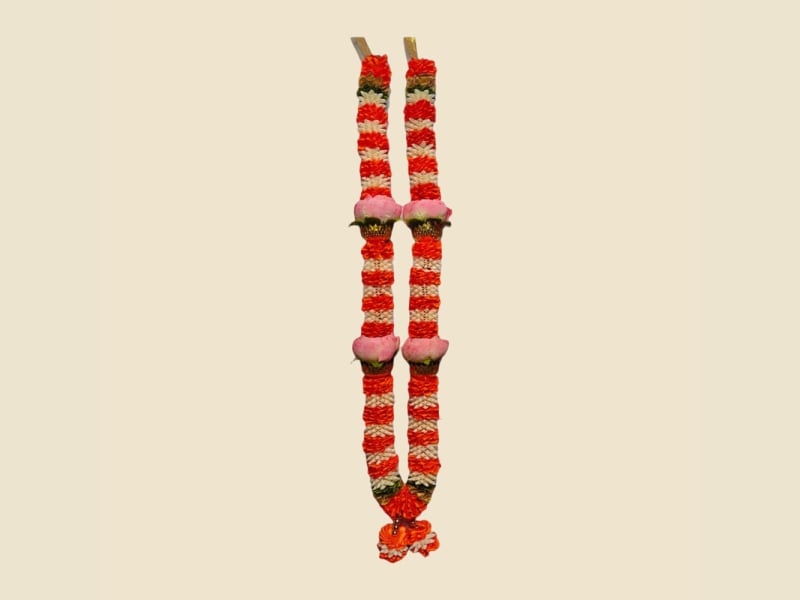 Red and white striped deity mala with red flower knots