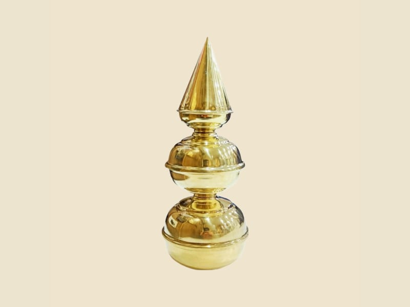 Brass Mandir Shikhar and Trishul on a warm ivory background
