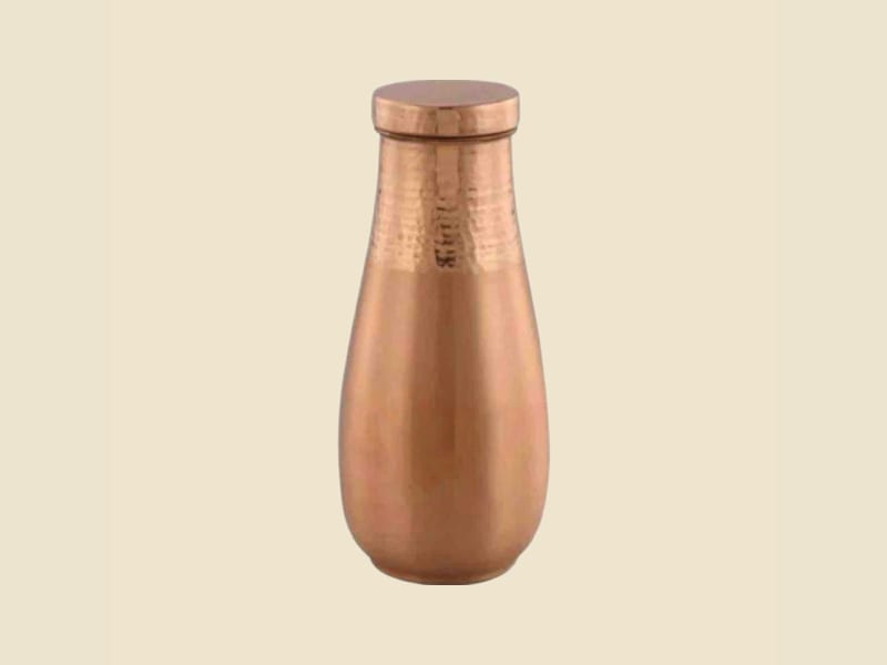 Hammered Copper Water Pot on a warm ivory background