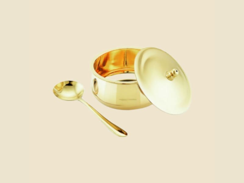 Brass Cookware on a warm ivory background