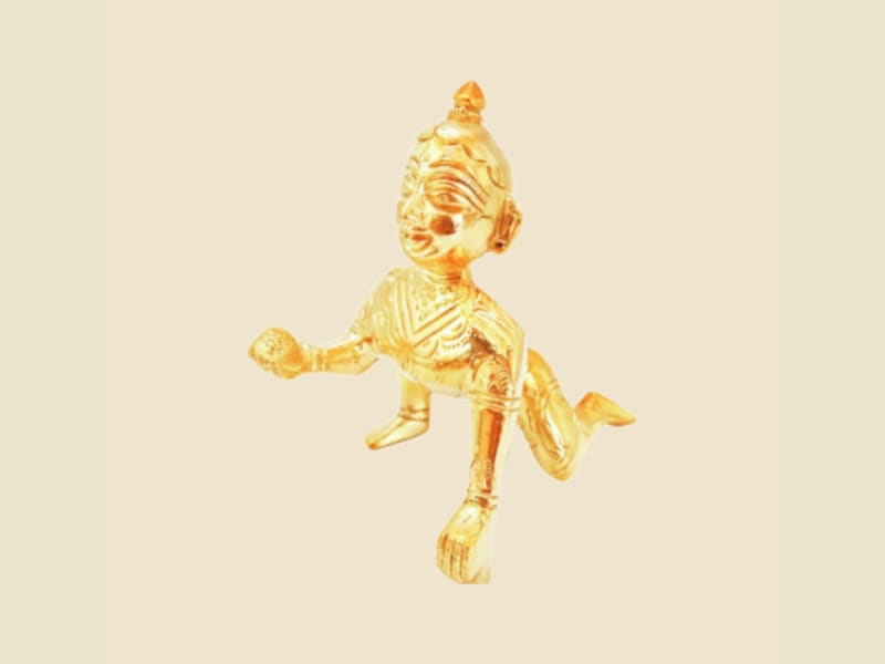 Brass Laddu Gopal, Light Antique Finish on a warm ivory background