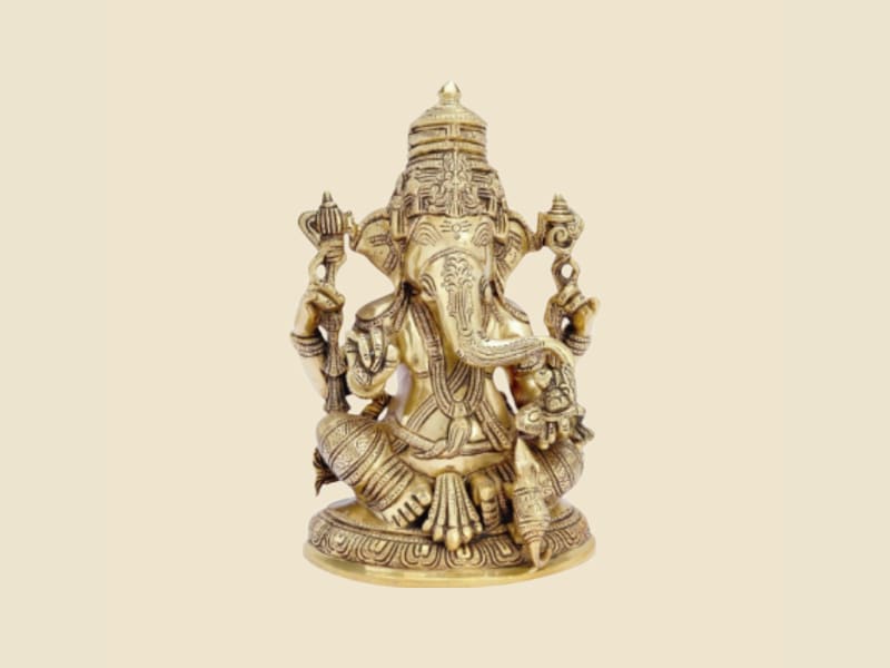 Brass Ganesha with Tall Crown and Mouse on a warm ivory background