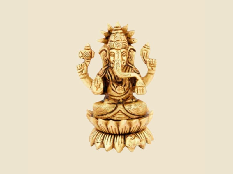 Brass Ganesha on Lotus Base on a warm ivory background