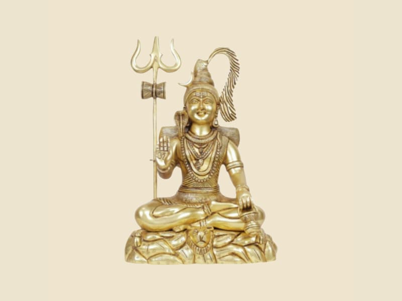 Brass Meditating Shiva with Trishul on a warm ivory background