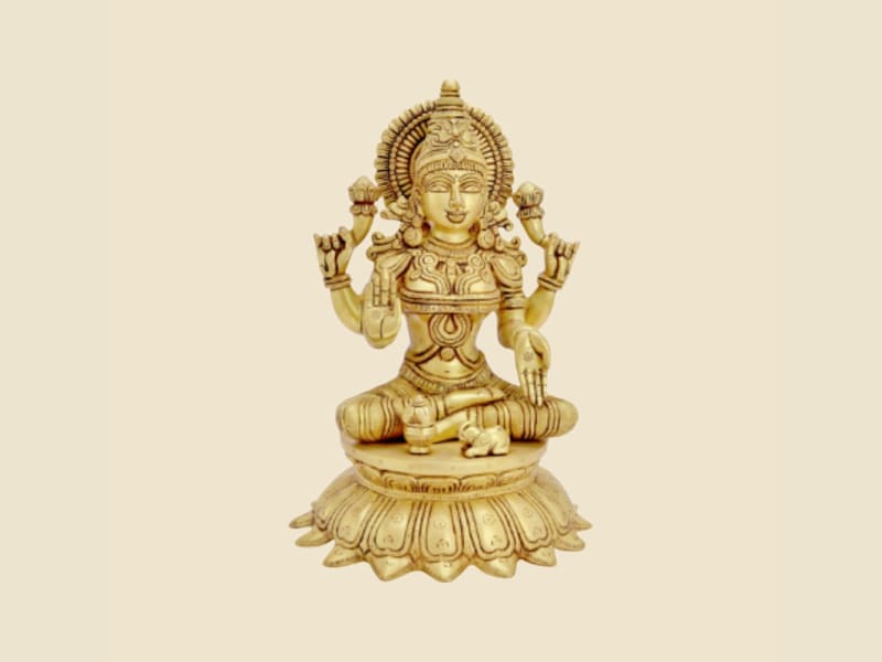Brass Lakshmi on Lotus, Light Finish on a warm ivory background