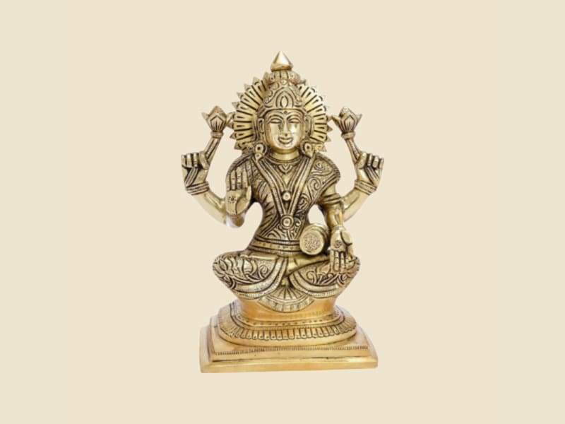 Brass Saraswati with Veena on Square Base on a warm ivory background