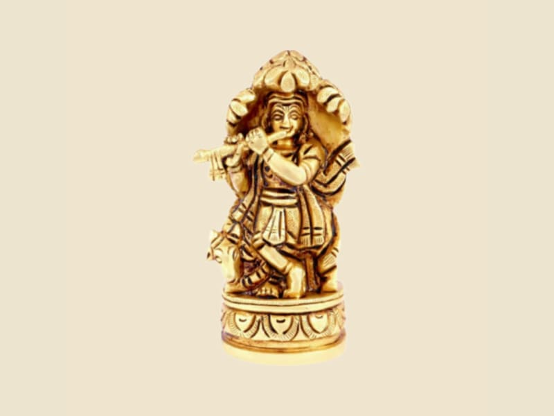 Copper-tone Krishna in Shrine Arch on a warm ivory background