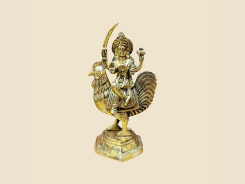 Brass Goddess on Rooster with Sword on a warm ivory background