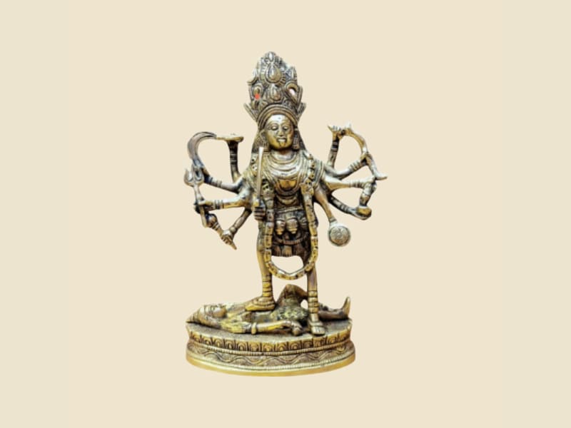 Brass Kali on a warm ivory background