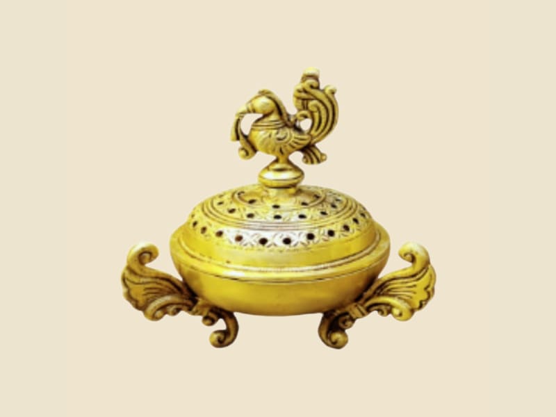 Brass Dhoop Dani with Peacock Lid on a warm ivory background