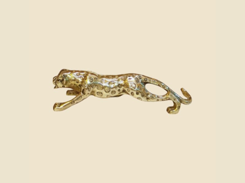 Brass Leopard Figurine on a warm ivory background