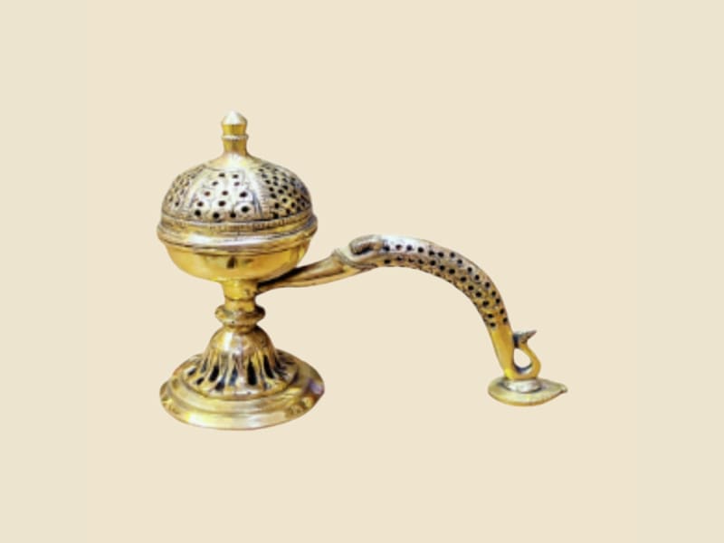 Brass Dhoop Burner with Spoon Handle on a warm ivory background