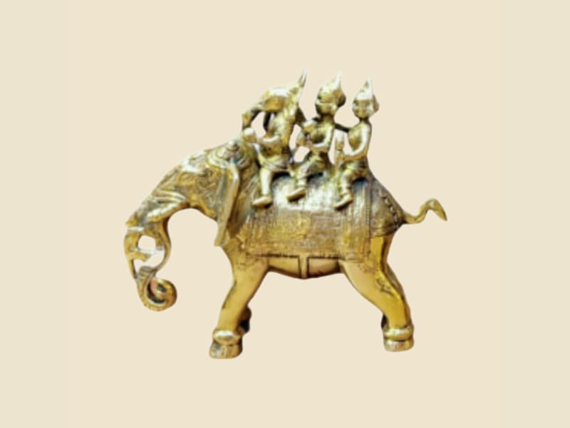 Brass Elephant with Deity Riders on a warm ivory background