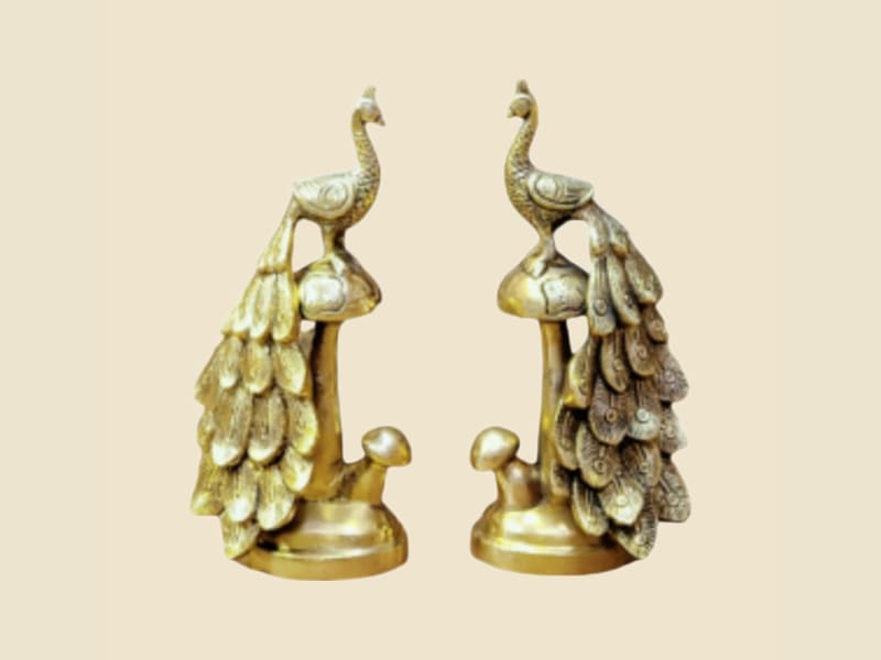 Brass Peacock Pair on a warm ivory background