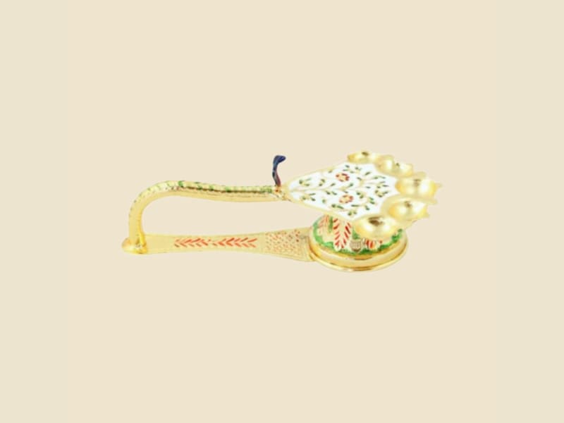 Meenakari Peacock Aarti (Multi-diya) on a warm ivory background