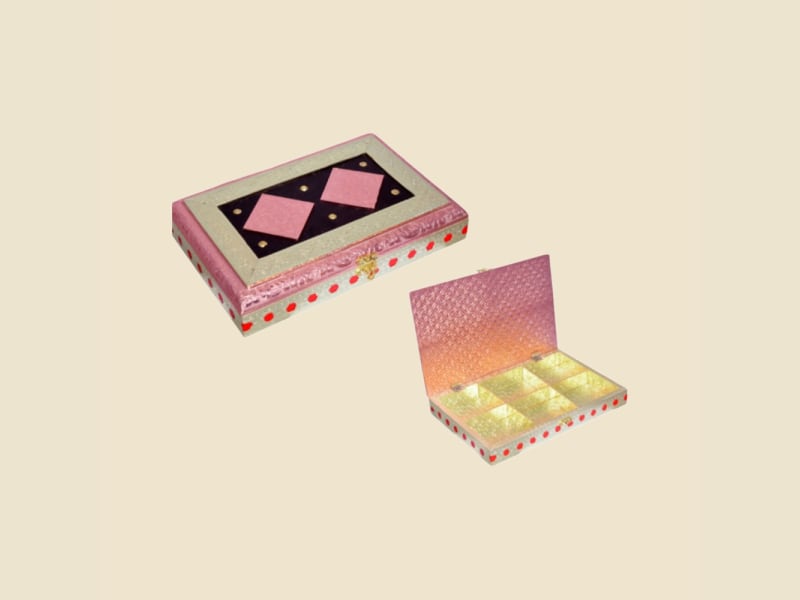 Pink Box with Black Panel on a warm ivory background