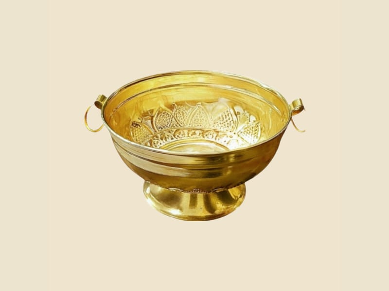 Brass Nakshi Flower Gangal on a warm ivory background