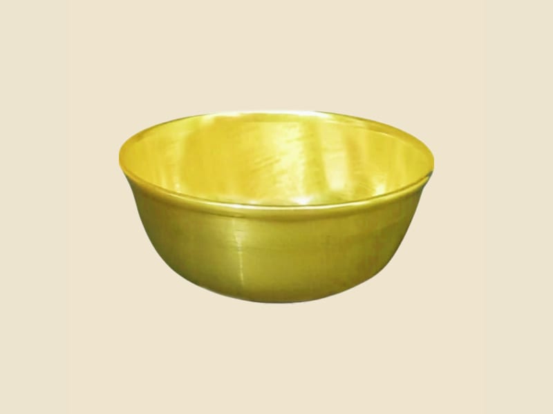 Brass Bidding Bowl on a warm ivory background