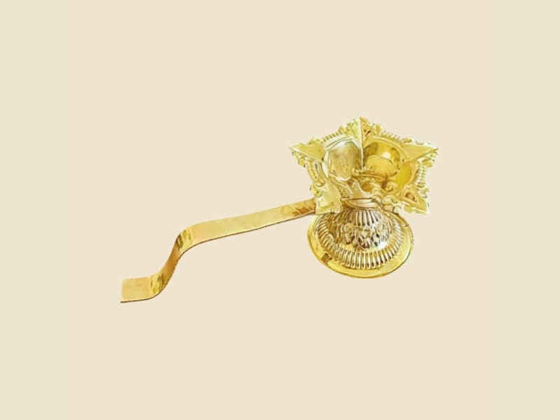 Brass Handle Luxury Deepak on a warm ivory background