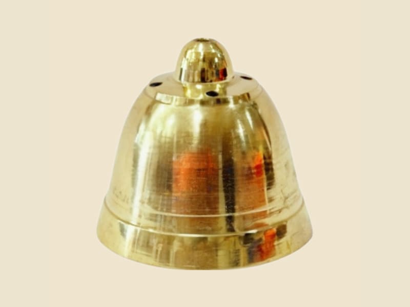 Brass Agardan Ghanti on a warm ivory background