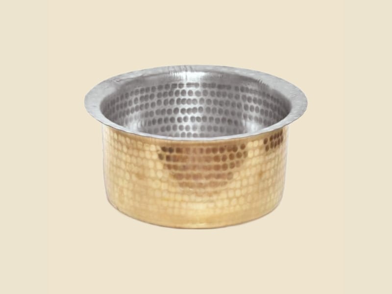 Brass Hammer Top Kalai Heavy on a warm ivory background