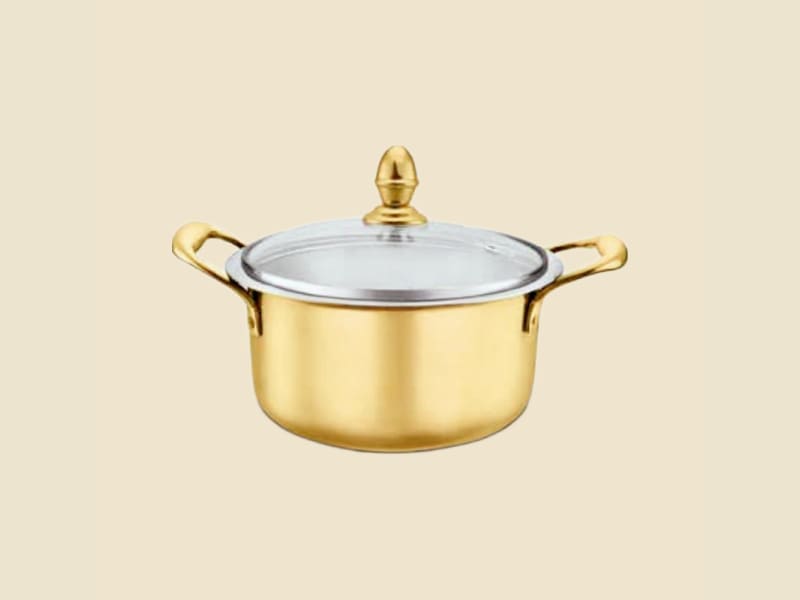 Brass Stock Pot on a warm ivory background