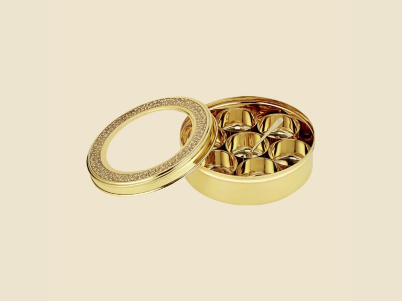 Brass Expo Masala Box on a warm ivory background