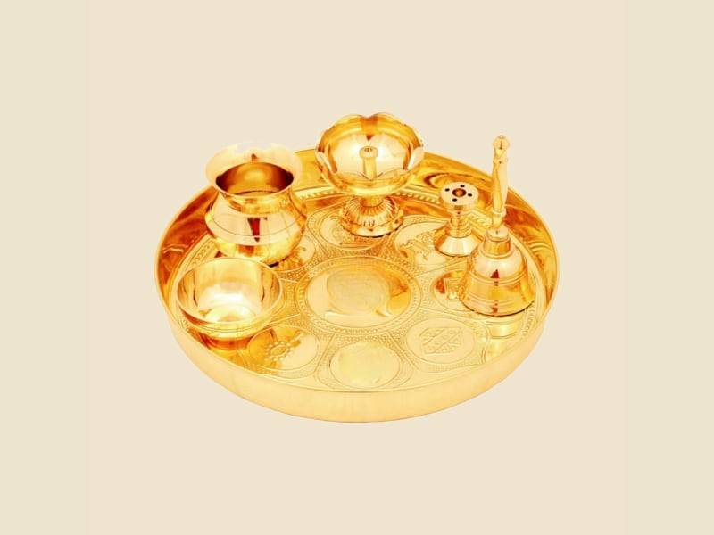 Asthamangal Brass Puja Thali Set on a warm ivory background