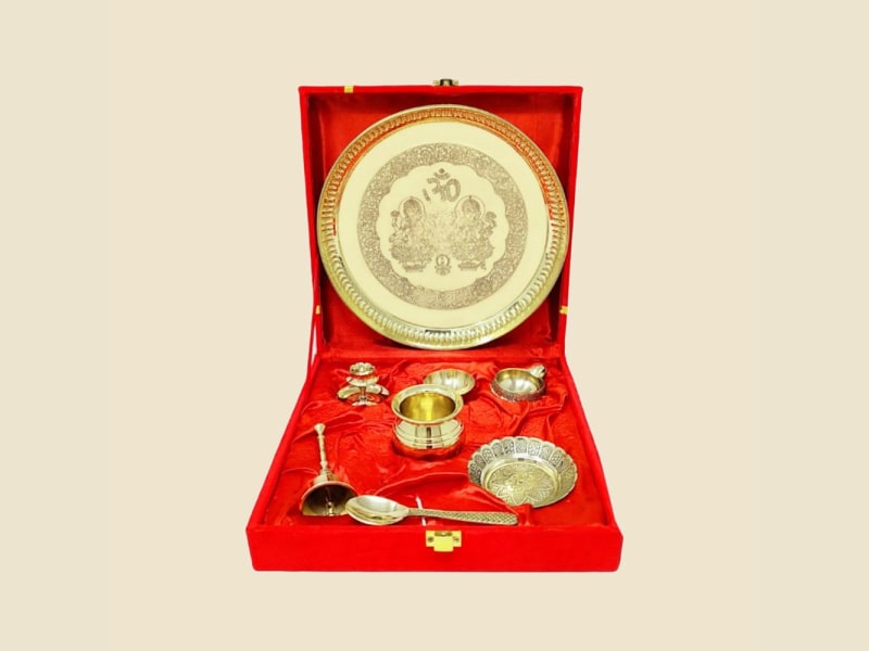 Laxmi-Ganesh Brass Puja Gift Set in Red Box on a warm ivory background