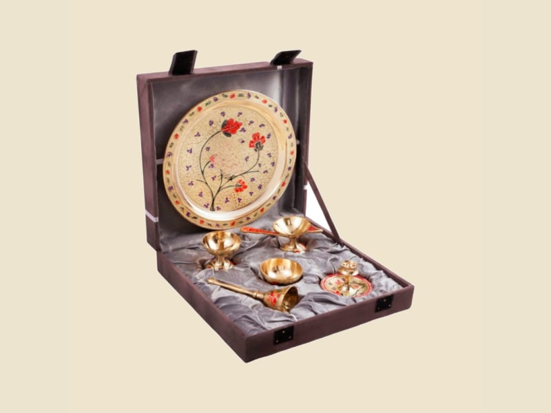 Brass Meenakari Puja Set in Brown Box on a warm ivory background