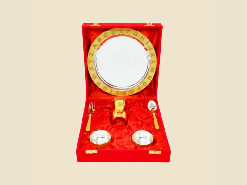 Gold-Finish ABCD Alphabet Plate Set in Red Box on a warm ivory background