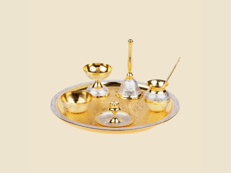 Two-Tone Brass Puja Thali Set on a warm ivory background