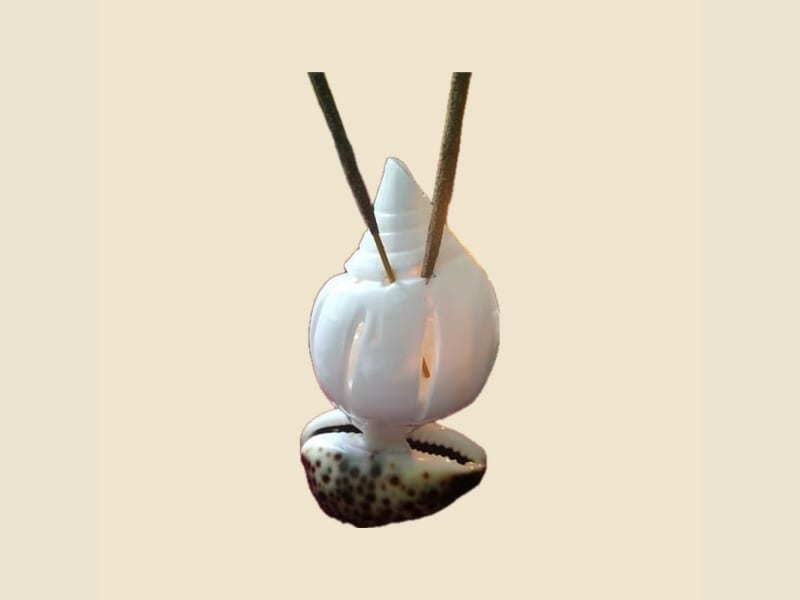 Shankh (Conch) Incense Holder on a warm ivory background