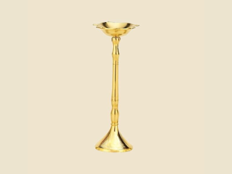 Brass Samay Diya, Medium on a warm ivory background