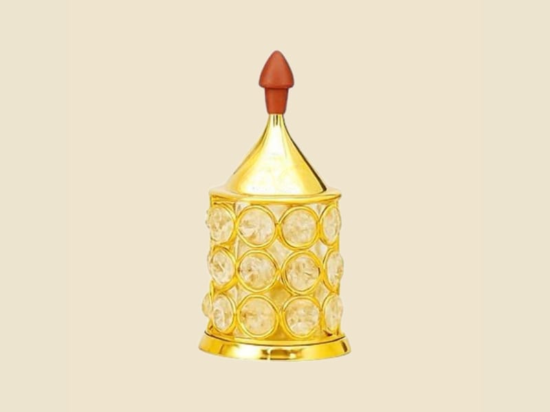 Crystal Pipe Brass Akhand Diya, Small on a warm ivory background