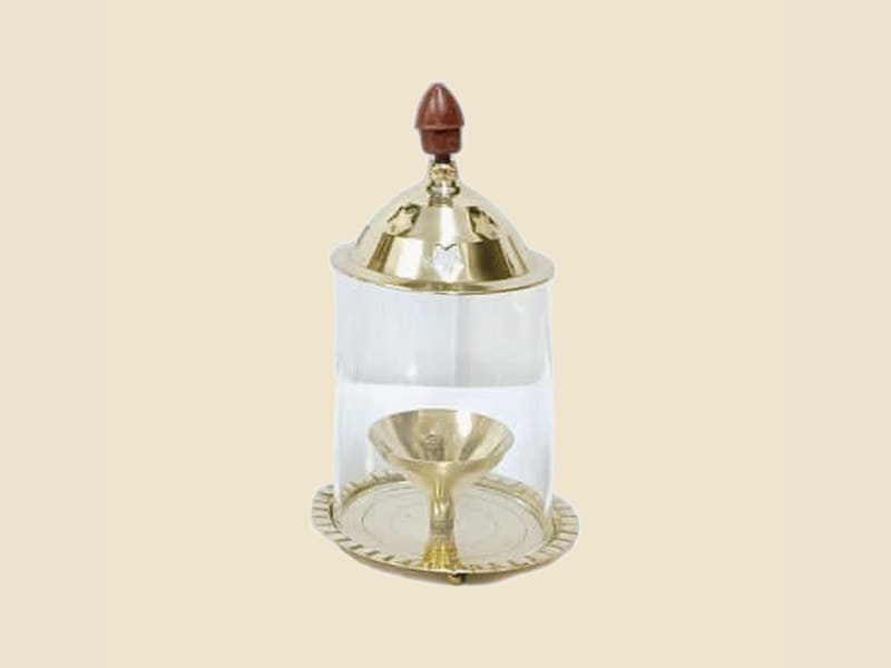 Brass Akhand Diya with Glass Dome, Medium on a warm ivory background